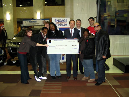 Picture of Doug Coulter presenting the cheque at the Kick off event on Thursday March 27.
