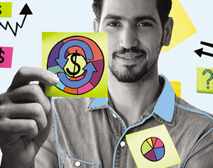 Man holding up a graph drawn on a sticky note. 