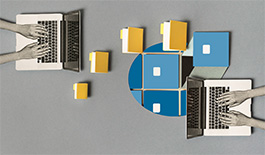 Laptops and files shows from a bird's eye view angle. 